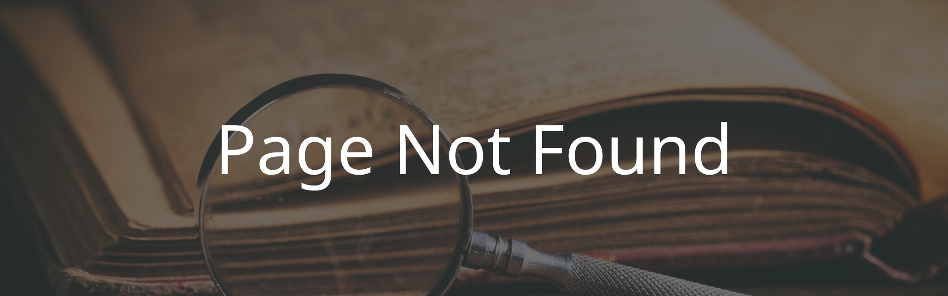 Page Not Found Image of warning. Shows antique book with magnifying glass in the background. Text overlay says "Page Not Found."